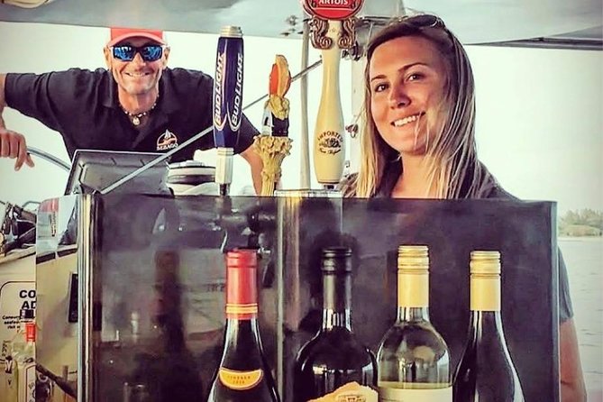 Key West Sunset Sail: Dolphin Watching, Wine, and Tapas - Crew service and the mood onboard