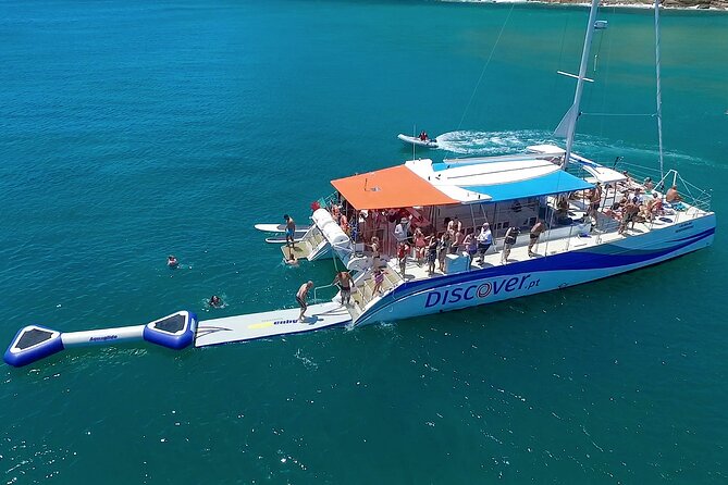 Lagos Half-Day Catamaran Cruise with Lunch - Swimming, paddleboards, and the inflatable waterpark