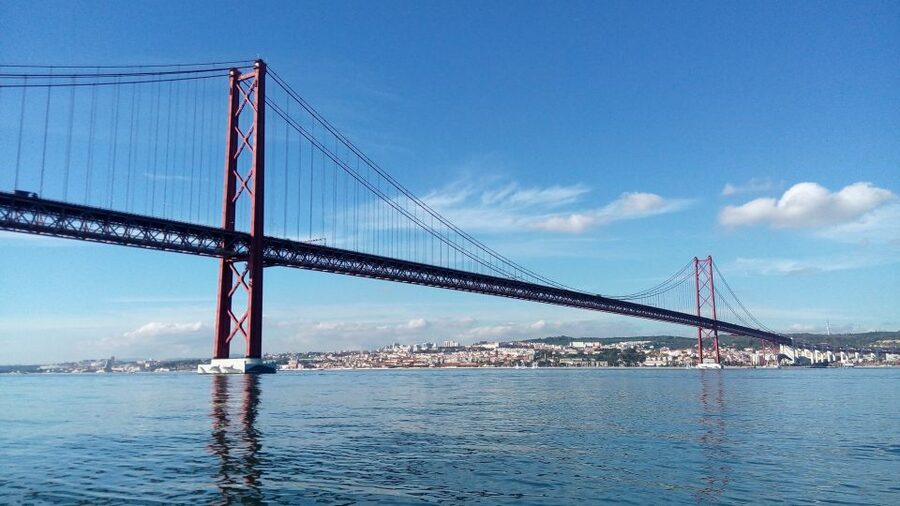 Lisbon: 2-Hour Sailing Yacht Cruise & Guided Tour w/2 drinks - Crossing toward the Vasco da Gama Bridge