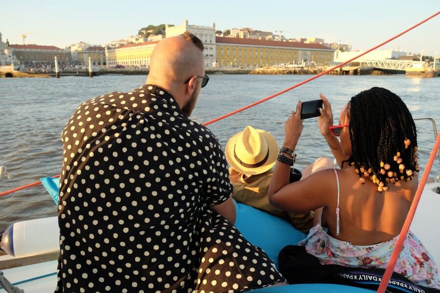 Lisbon: City Skyline Sailboat Cruise with Drink and Snacks - Sunset, weather, and the feel on board