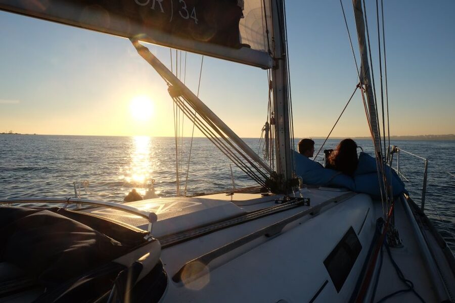 Lisbon: City Skyline Sailboat Cruise with Drink and Snacks - Crew, languages, and group size