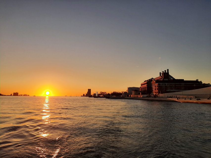 Lisbon: City Skyline Sailboat Cruise with Drink and Snacks - Under the 25 de Abril Bridge