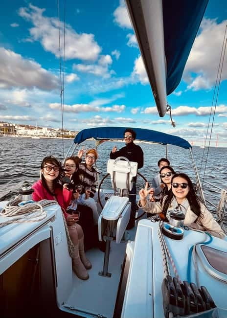 Lisbon On a Sailboat - Cultural Facts and Sailing Experience - Your Captain moment at the wheel