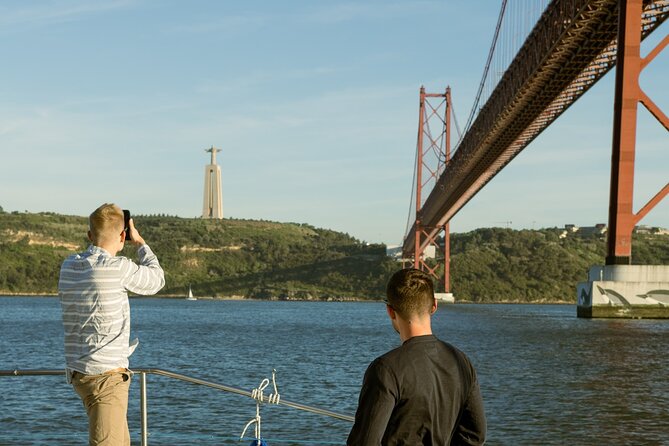 Lisbon: Sunset Catamaran Boat Tour with Music and Drinks - The 25th of April Bridge and Christ the King