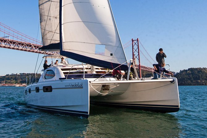 Lisbon: Sunset Cruise With Drinks on Spacious Yacht - The bridge, Christ the King, and the long western run