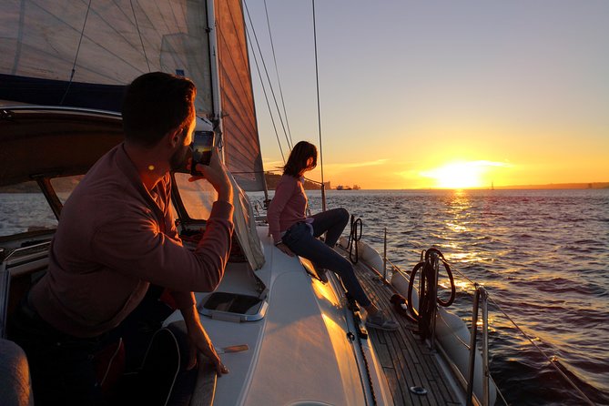 Lisbon Sunset Sailing Tour on Luxury Sailing Yacht with 2 Drinks - Wine, beer, cheese, and the sunset pause