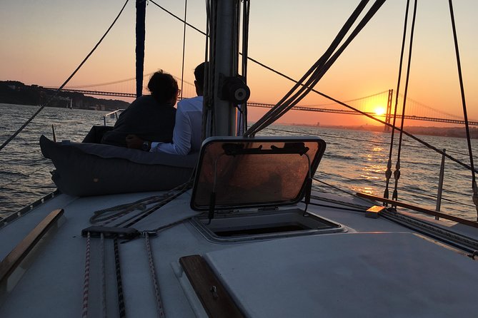 Lisbon Sunset Sailing Tour with White or Rosé Wine and Snacks - Wine, cheese, chouriço, and the social side