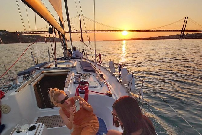 Lisbon Sunset Sailing with Portuguese Wine and History - The 25th April Bridge and Christ the King