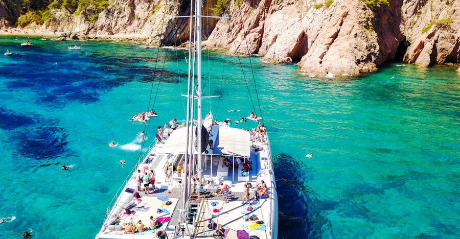 Lloret de Mar: Catamaran Sailing Cruise with BBQ and Drinks - Sailing out from Lloret de Mar beach