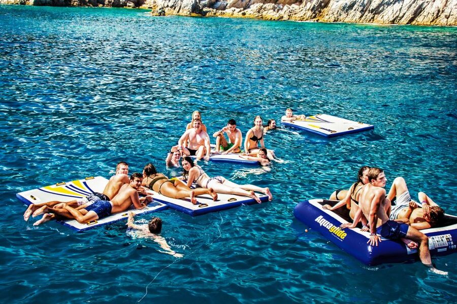 Lloret de Mar: Catamaran Sailing Cruise with BBQ and Drinks - The first hour: cliffs, caves, and Costa Brava views