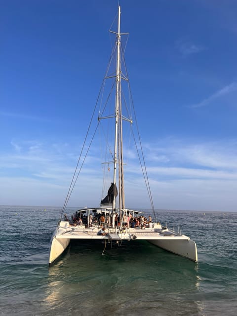 Lloret de Mar: Sunset Catamaran Cruise with DJ and Drinks - The Costa Brava coast from the water