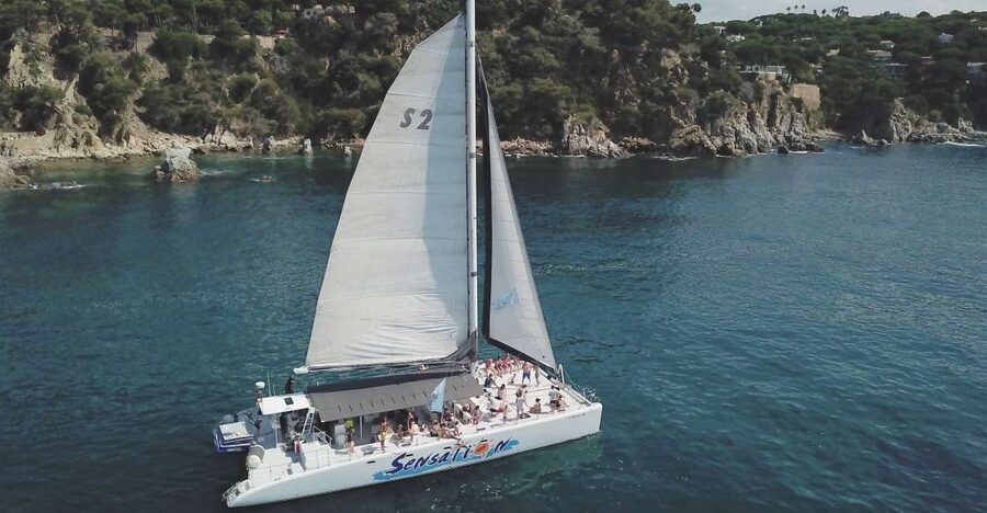 Lloret de Mar: Sunset Catamaran Cruise with DJ and Drinks - Drinks, music, and the party mood
