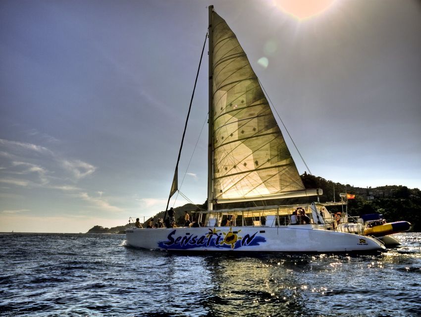 Lloret de Mar: Sunset Catamaran Cruise with DJ and Drinks - What the swim stop adds