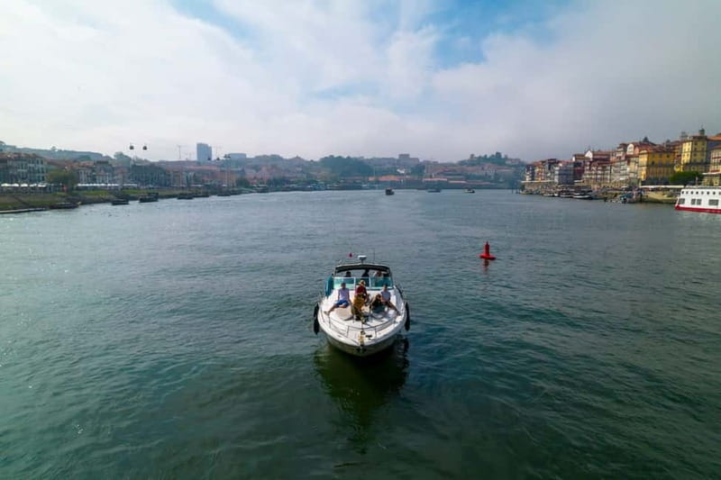 Luxury Douro Yacht Tour: Scenic Views & Complimentary Drinks - The yacht, seating, and onboard mood