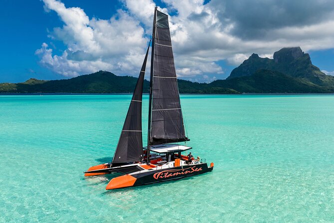 LUXURY PRIVATE Catamaran : Full-Day Sail & Polynesian Motu Lunch - Swimming and snorkeling in a scenic bay