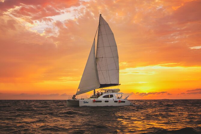 Luxury Sunset Sailing Cruise in Cancun with Light Dinner and Open Bar - The catamaran, seating, and view from the deck