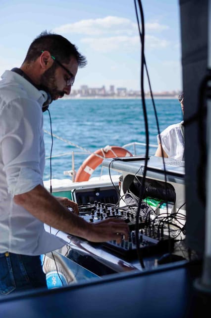Malaga: Catamaran Sailing Cruise with Swimming & Optional DJ - Music, DJ choices, and the onboard mood