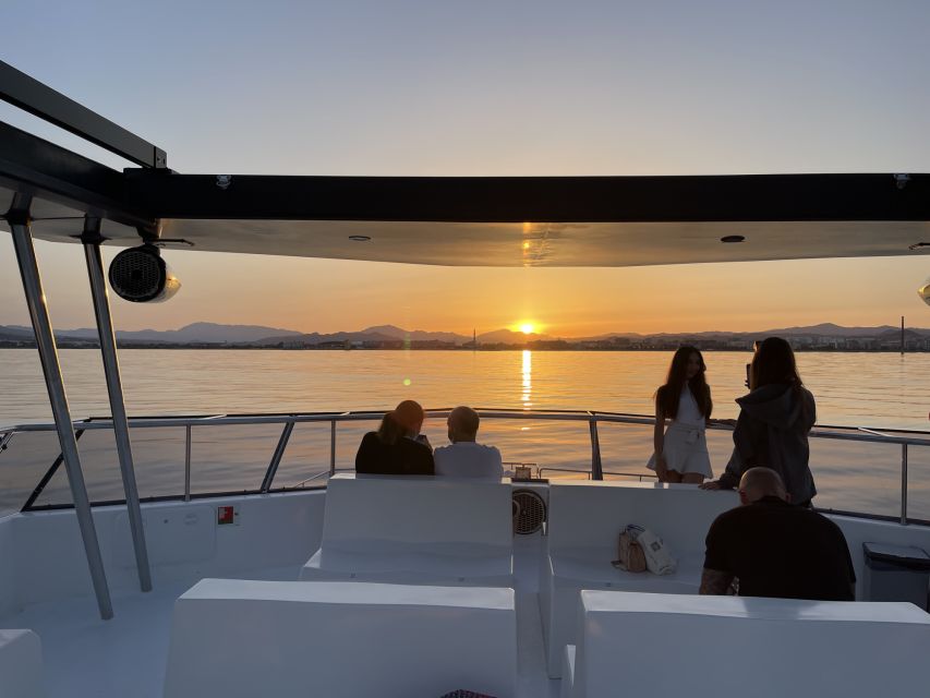 Málaga: Sunset Catamaran Trip - Leaving Málaga Port as the City Lights Up