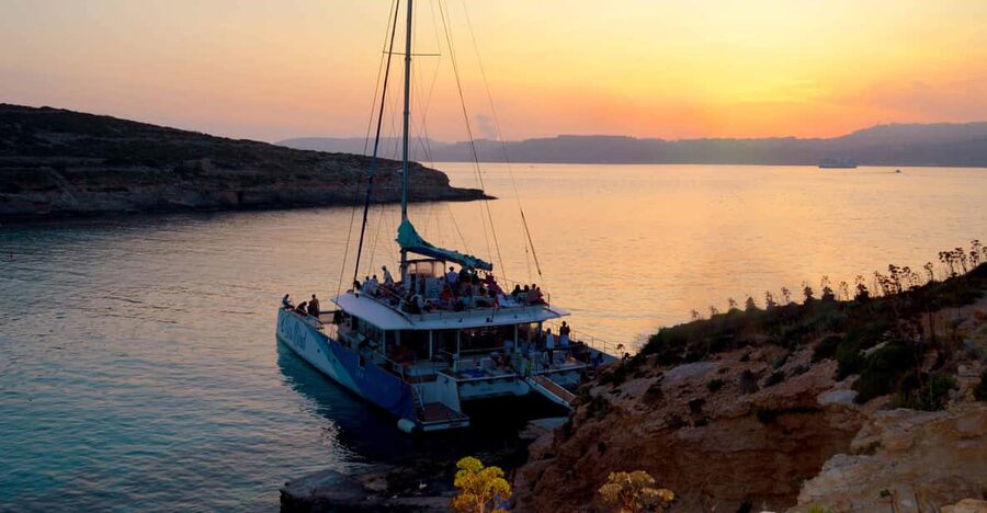 Malta: Blue Lagoon Evening Catamaran Cruise - The first hours: cliffs, caves, and Malta from the water