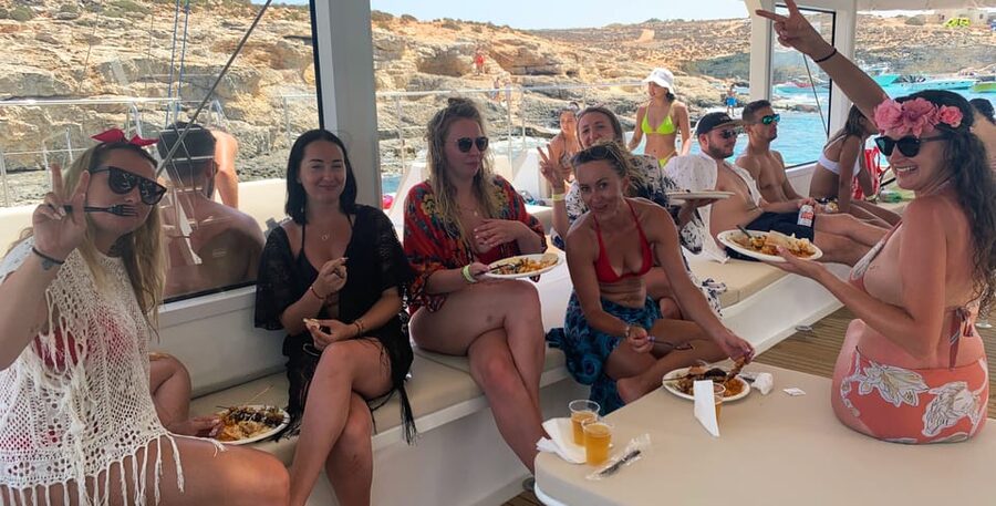 Malta: Blue Lagoon Evening Catamaran Cruise - Sunset, cocktails, and the social side of the boat