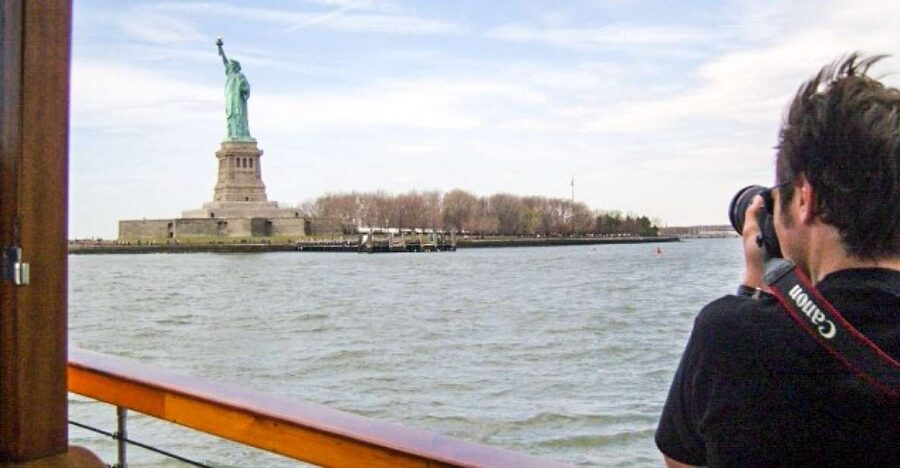 Manhattan: Statue and Skyline Cruise Aboard a Luxury Yacht - The indoor salon, outer deck, and onboard drink