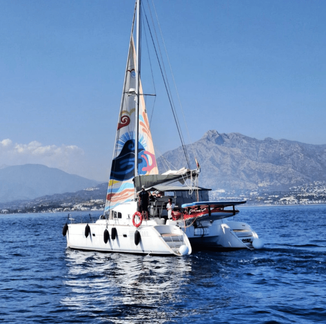 Marbella: Group Dolphin Watching Catamaran Tour with Snacks - Setting Sail from Puerto José Banús