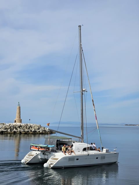 Marbella: Group Dolphin Watching Catamaran Tour with Snacks - Swimming and Water Sports When Conditions Allow