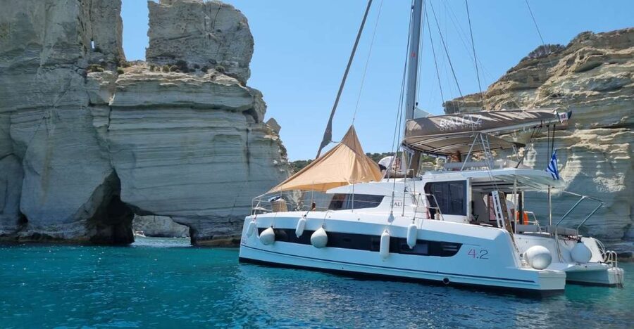 Milos: Full-Day Catamaran Cruise with Food and Open Bar - Four swim stops, volcanic cliffs, and a full day at sea