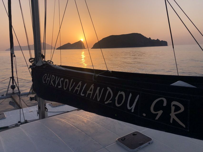 Milos: Sunset Catamaran Cruise with Kleftiko Visit - Sailing the west coast toward Kleftiko
