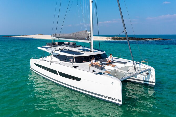 Mykonos: Brand-New Catamaran Cruise with Meal, Drinks & Transport - Leaving Mykonos behind by catamaran