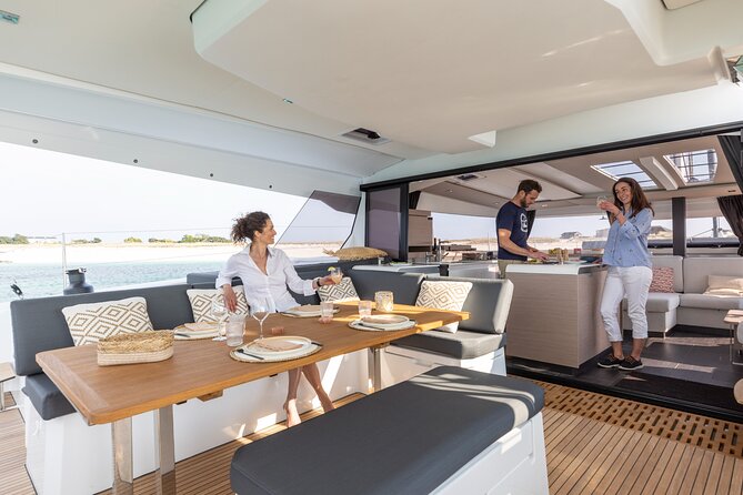 Mykonos: Brand-New Catamaran Cruise with Meal, Drinks & Transport - Lunch, drinks, and the social mood