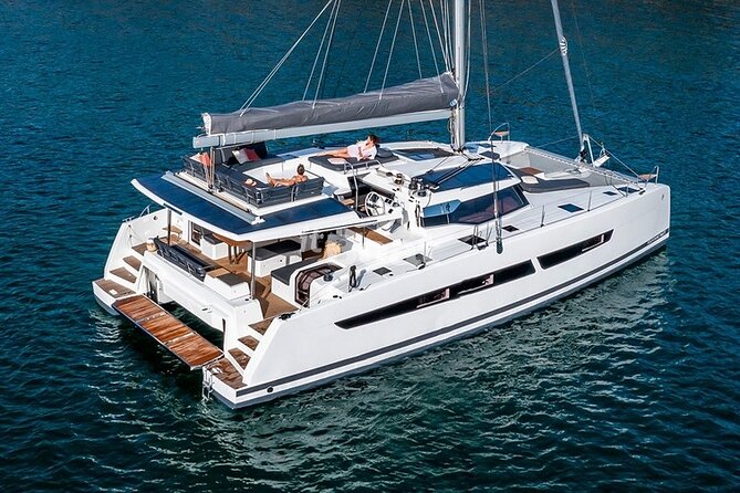 Mykonos: Brand-New Catamaran Cruise with Meal, Drinks & Transport - A passing view of Delos