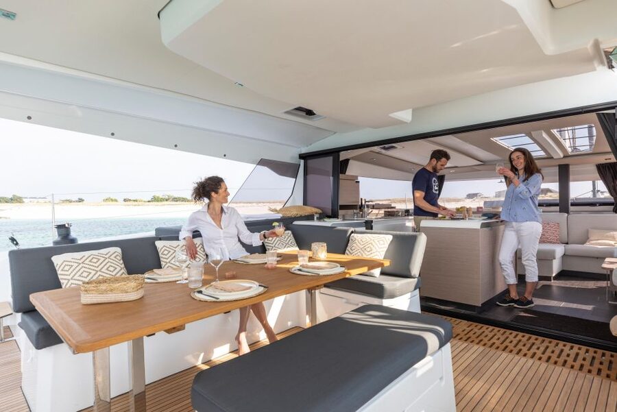 Mykonos: Catamaran Cruise with 3-Course Meal and Transfers - Sailing toward Rhenia and Delos
