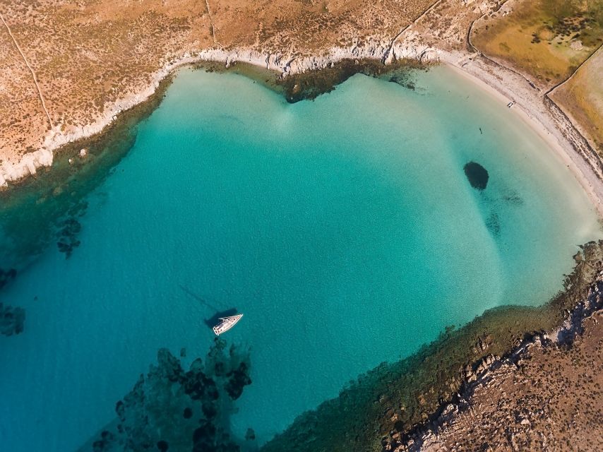 Mykonos: Catamaran Cruise with Lunch, Drinks and Transfer - Leaving Mykonos by catamaran
