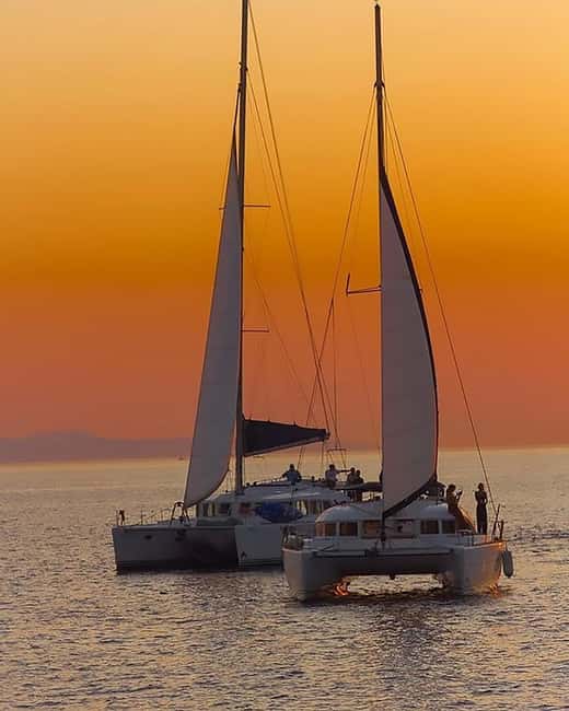 Mykonos: Rhenia Island Catamaran Cruise with Meal and Drinks - The return sail and Mykonos from the water