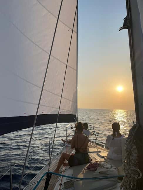 Mykonos: Sunset Sail Cruise to Rhenia, Beach Hopping, Dinner - Crew and the feel on board