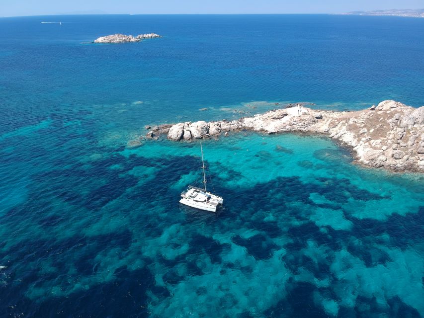 Naxos: Luxury Catamaran Day Trip with Lunch and Drinks - Greek lunch, fruit, coffee, and wine on board