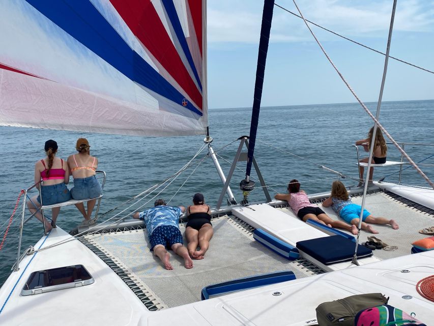 Ocean City: Sailing Catamaran Cruise with Crew - Watching for dolphins near the bow