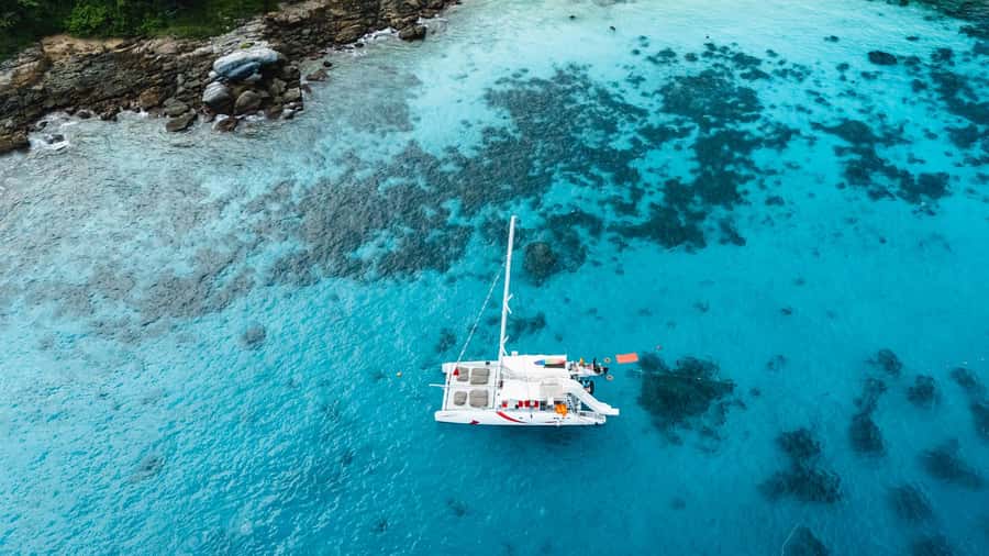 Phuket: Coral, Racha, Promthep Island Catamaran Trip & Lunch - Snorkeling, beach time, and optional water sports