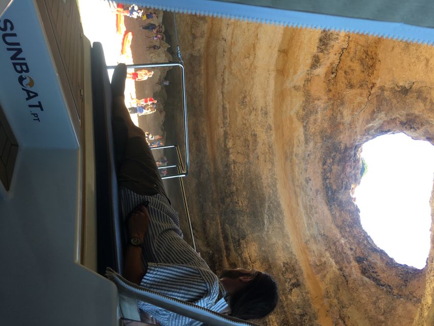 Portimão: Benagil Caves & Golden Coast Eco Catamaran Tour - Entering Benagil Cave and the nearby openings