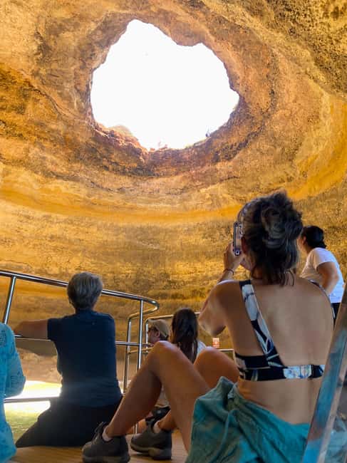 Portimao: SUNSET Benagil Caves Tour | Eco Catamaran - Following the Algarve cliffs toward Benagil