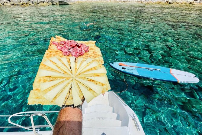 Porto Conte: Half-day catamaran tour with aperitif - Cala Dragunara and the swimming stop