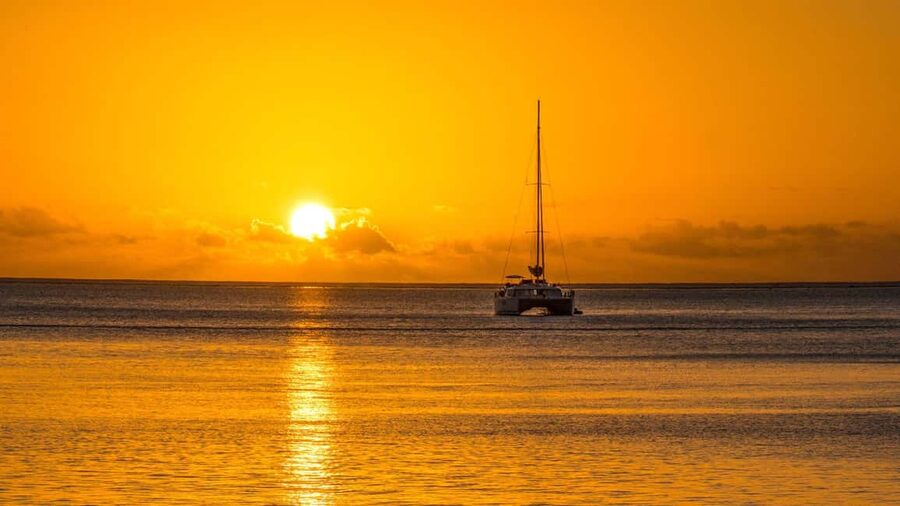 Porto Conte: Sunset catamaran excursion with aperitif - Sailing toward Capo Caccia