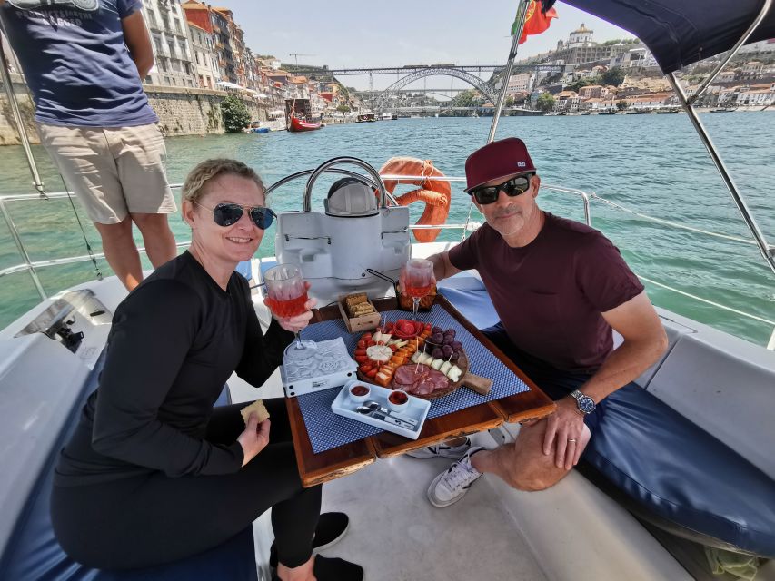 Porto: Private Sailboat Trip with Wine Tasting & Charcuterie - Sailing past the Arrábida Bridge