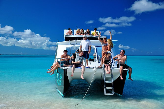 Private 4 Hour Power Catamaran Excursion in Grace Bay - Snorkeling, swimming, tubing, and the jump board