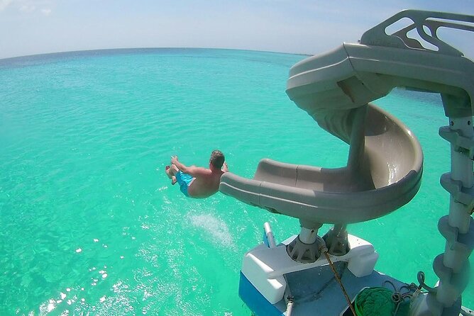 Private Catamaran Adventure Cruise with Rope Swing and Water Slide - Who will enjoy the Dolphin most?