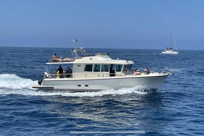 Private Full-Day Motor Yacht Cruise with Meal, Open Bar+Transfers - Mesa Pigadia, the lighthouse, and the volcanic caldera