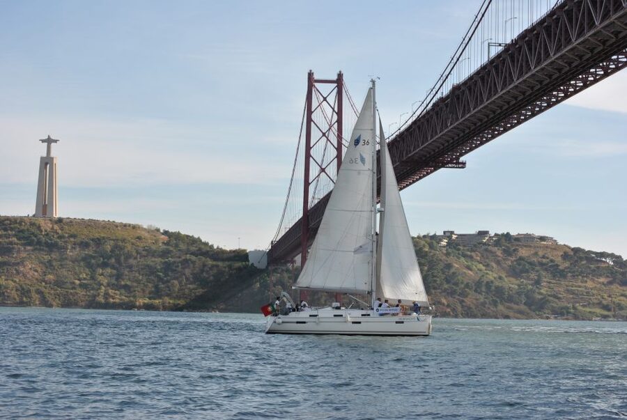 Private Sailing Boat Tour Lisbon with a drink: 2 to 8 Hours - Under the 25 de Abril Bridge