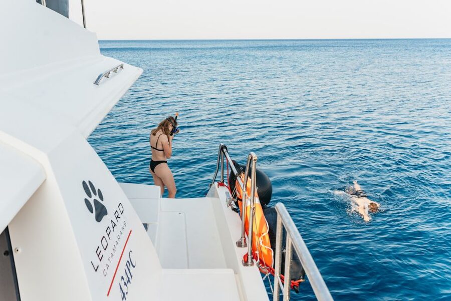 Rhodes: Sunset Catamaran Cruise with Dinner Buffet & Drinks - Sunset from open water near Rhodes Town