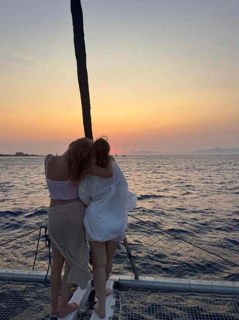 Rhodes: Sunset Catamaran Cruise with Snack, Fruits & Drinks - From Mandraki Harbour into the evening light